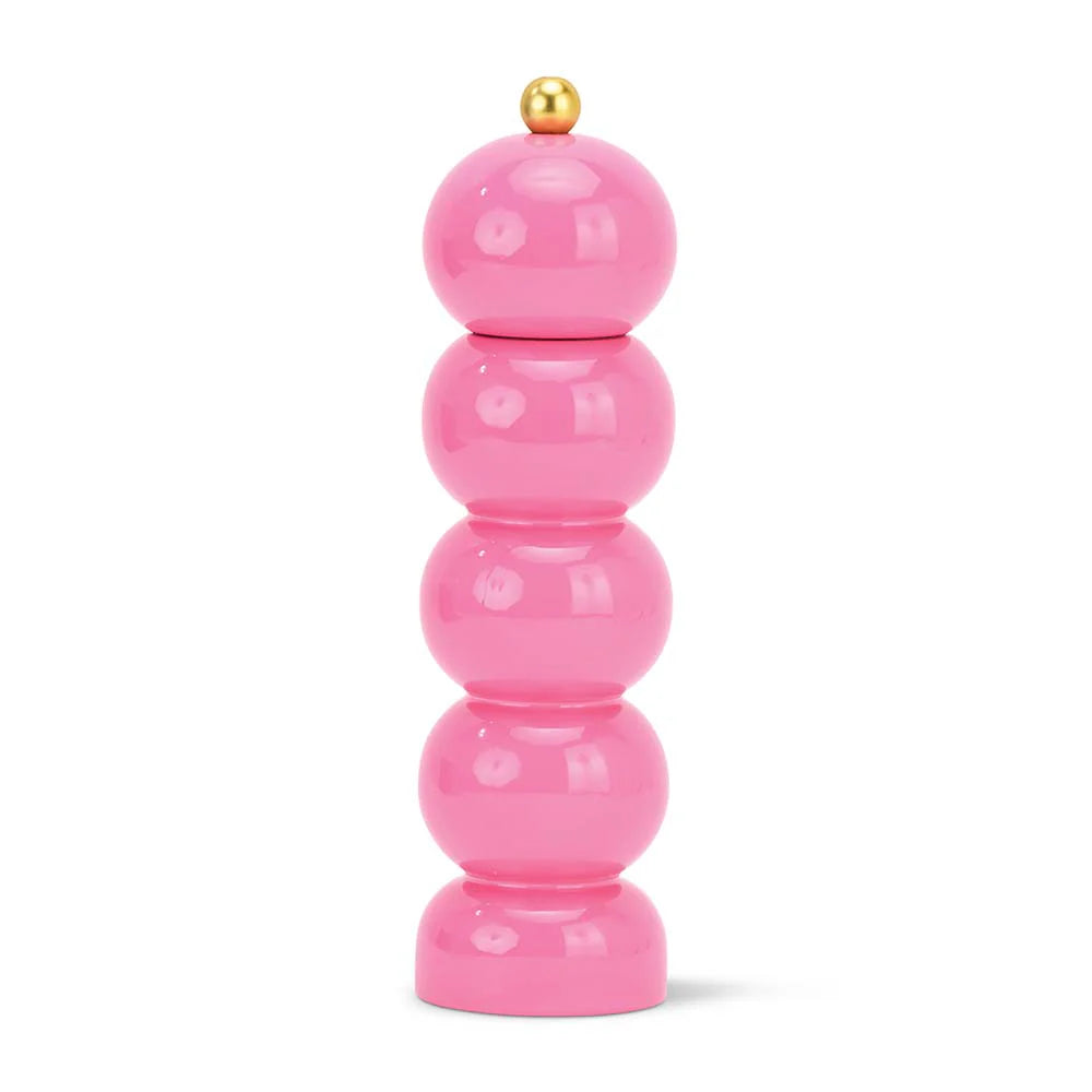 Stack of pink cylindrical objects with a gold top on a white background