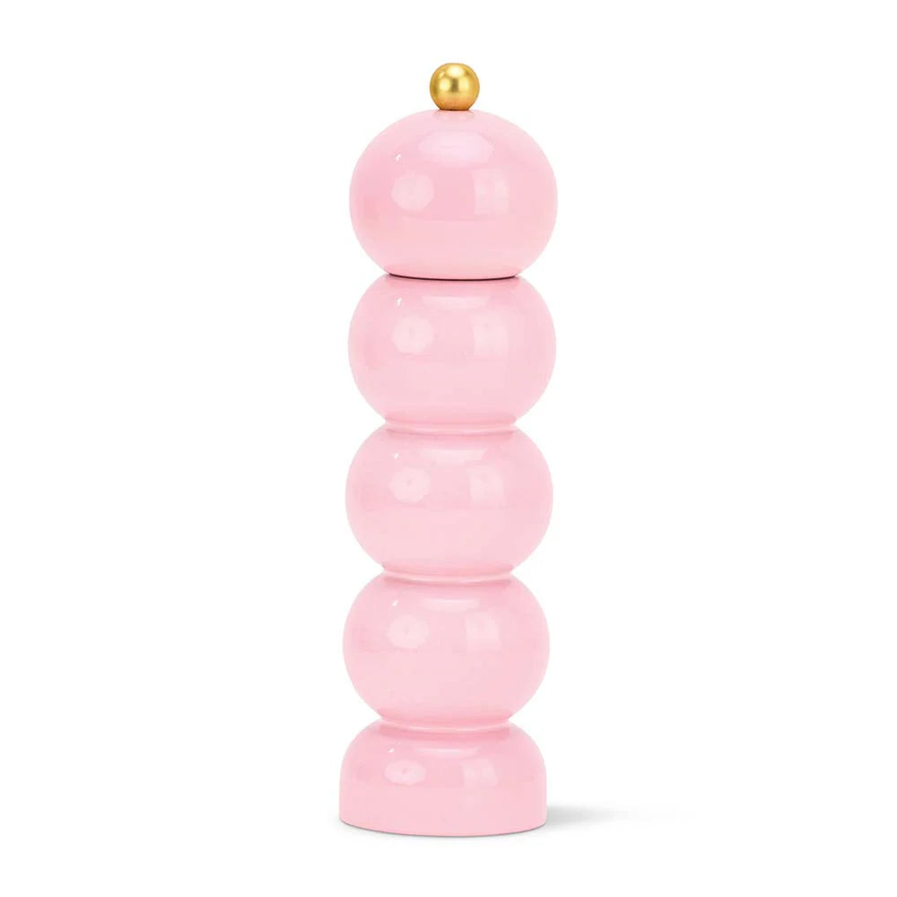 Stack of pink cylindrical objects with a gold top on a white background