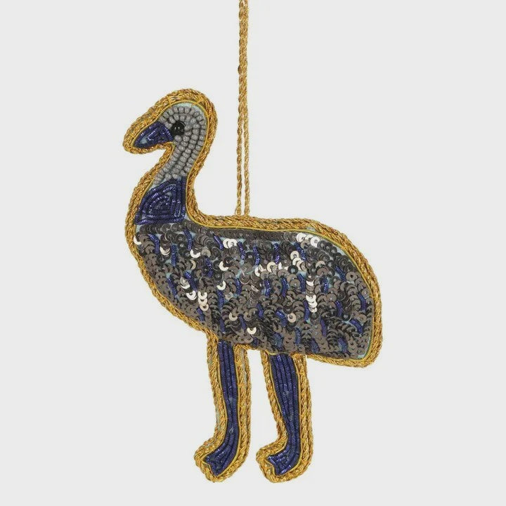 A handmade beaded Christmas decoration shaped like an emu, predominantly blue with sequin embellishments.