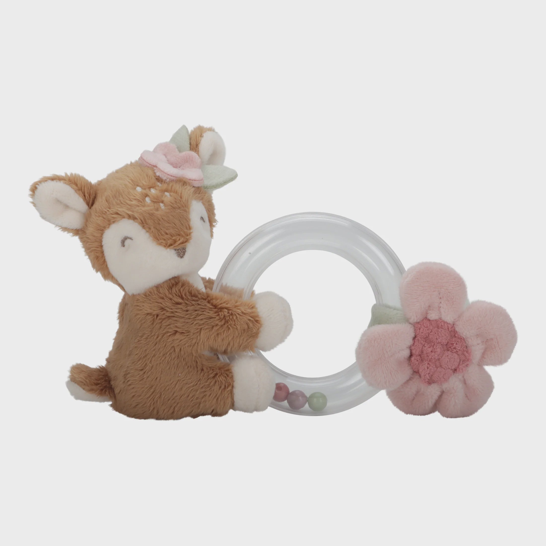 Plush deer toy with a teething ring and pink flower on a light gray background