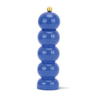 Blue pepper grinder with gold top on a white background