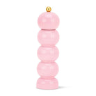 Stack of pink cylindrical objects with a gold top on a white background