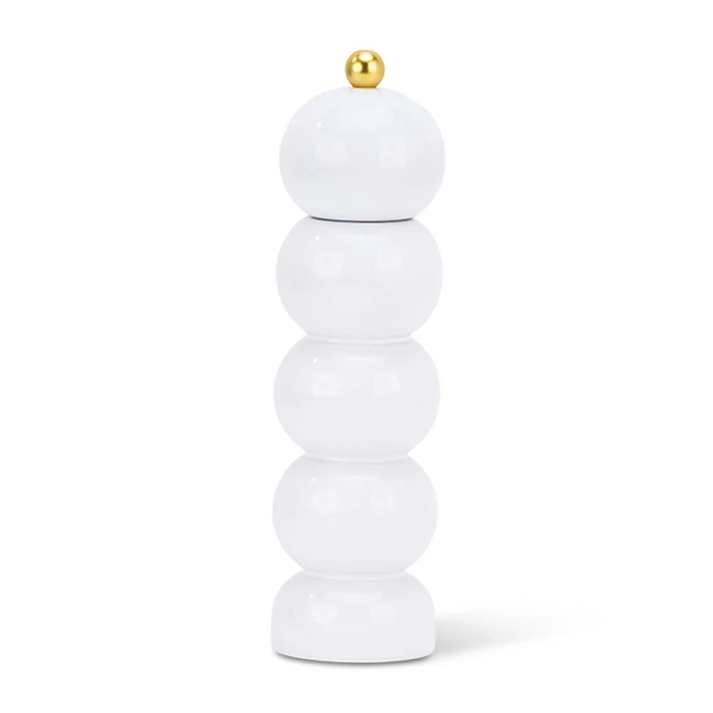 Stack of white cylindrical objects with a gold top on a white background