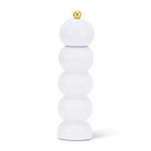 Stack of white cylindrical objects with a gold top on a white background
